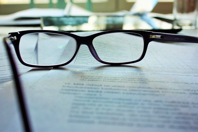 Pair of glasses on a document