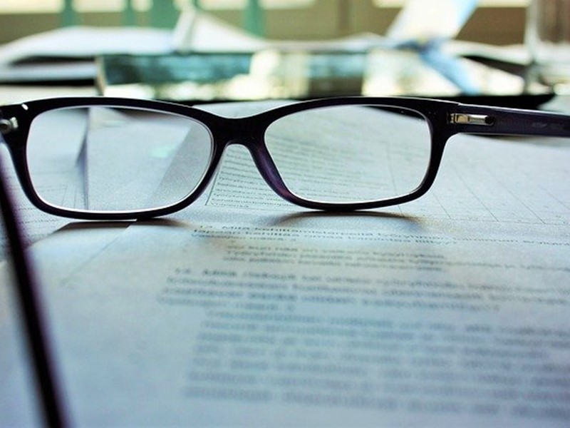 pair of glasses on a document