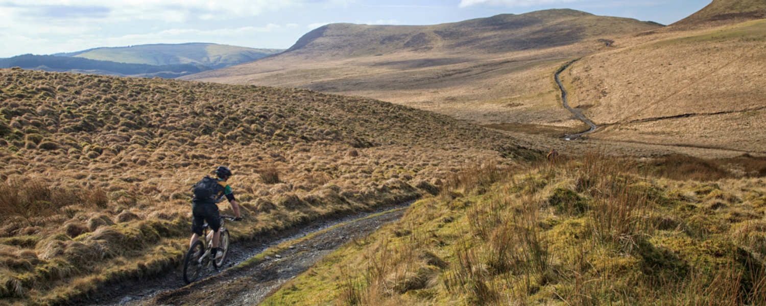 man riding mountain bike on Cambrian Mountain cycle path