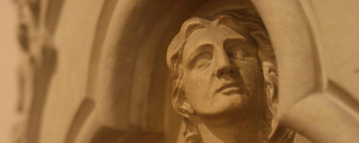 head of statue on church wall