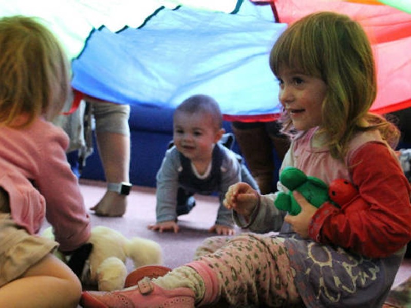 1-3 year old children playing in a tent